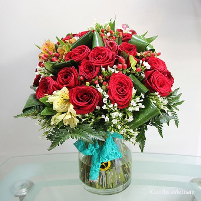 product image for Red roses and seasonal flowers in vase