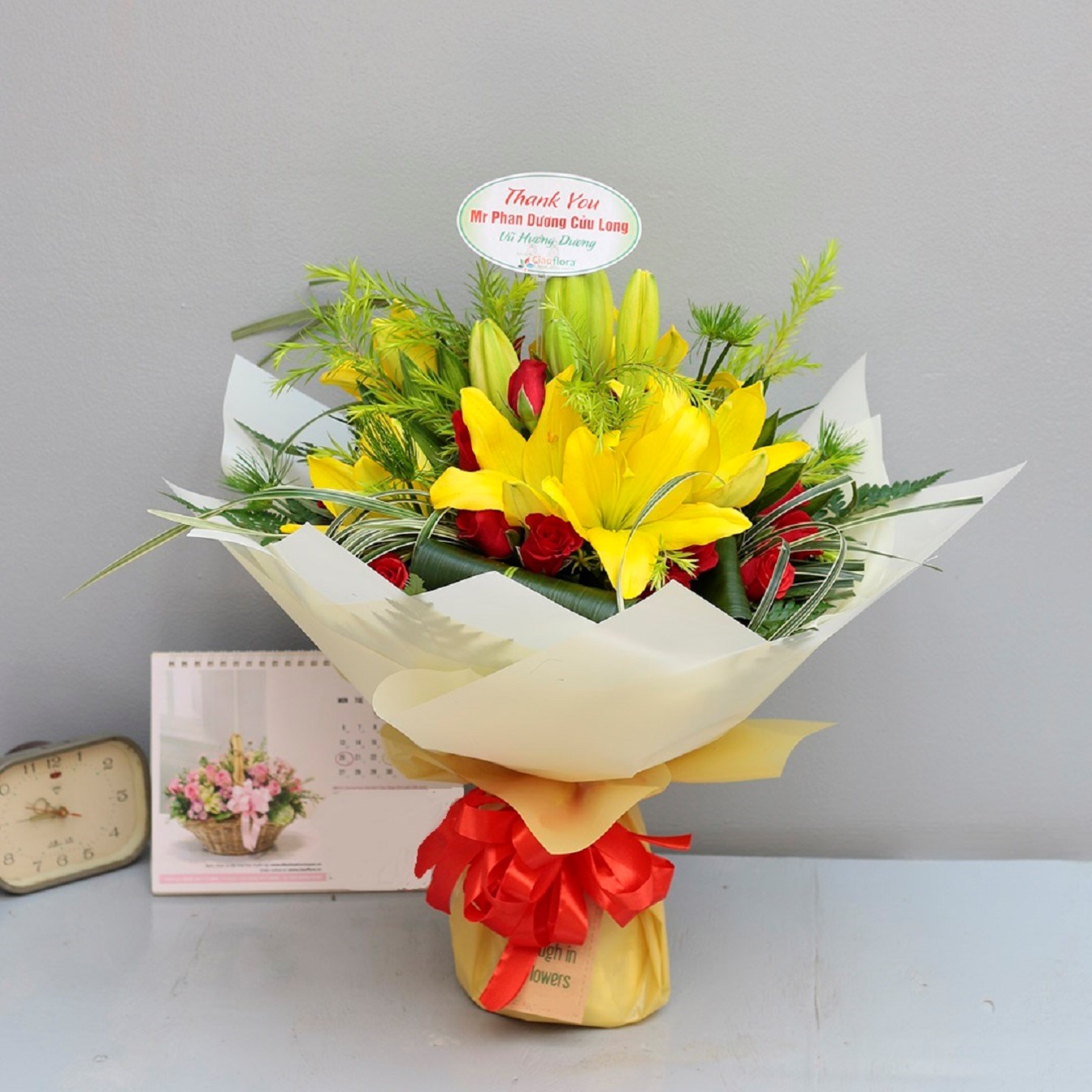 Yellow lilies with red and green