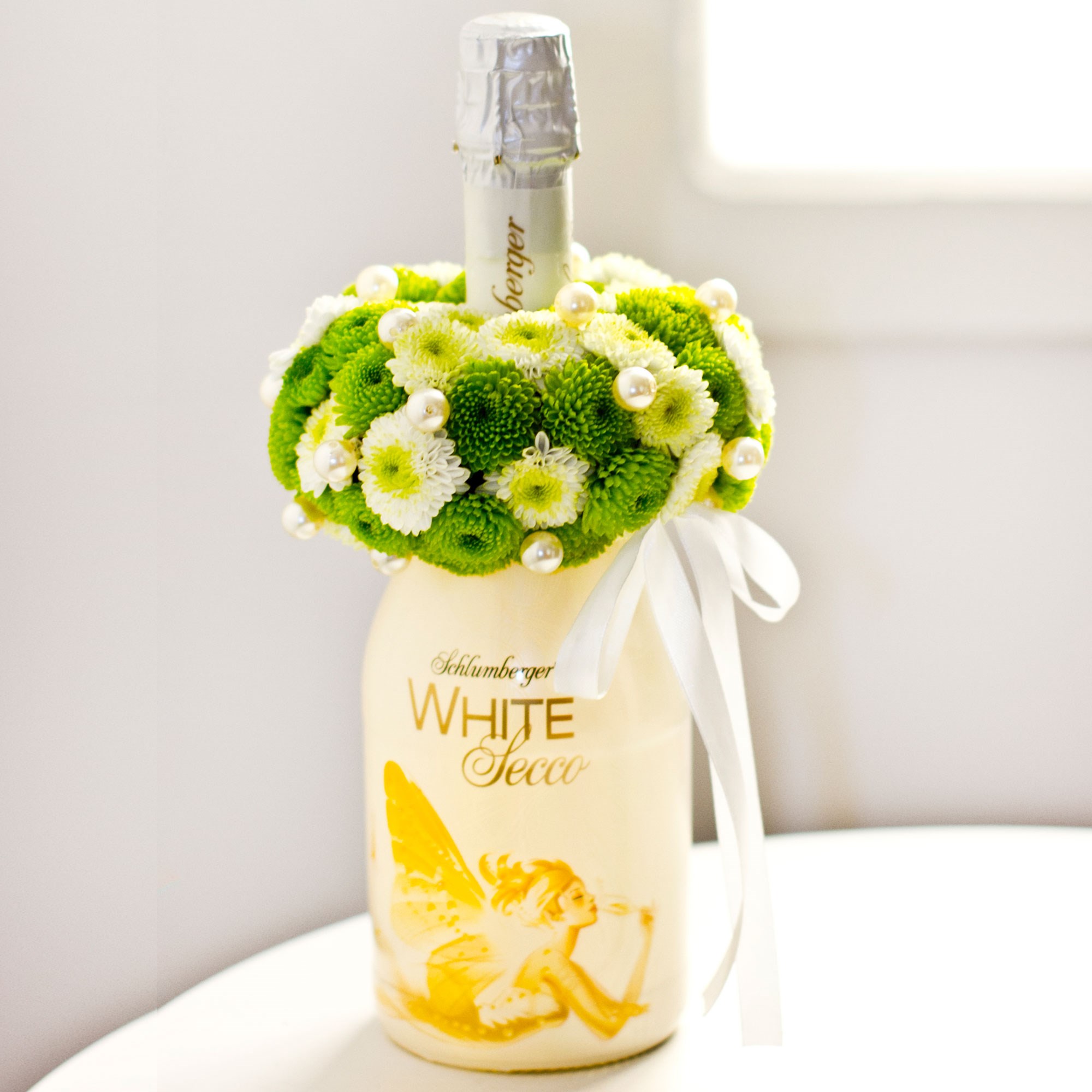 Sparkling Wine Decorated with White Flowers
