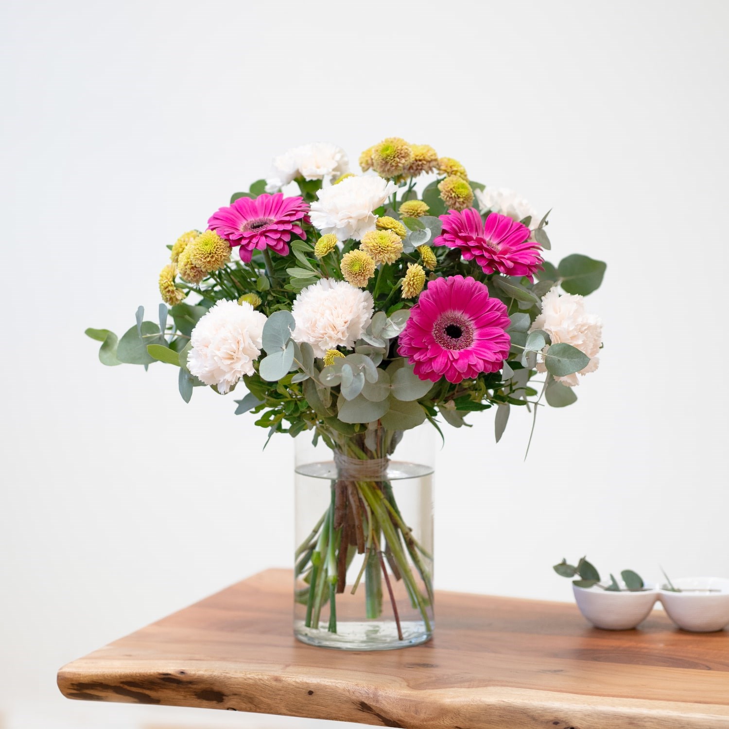 Bouquet of carnations and mixed flowers in cream and violet