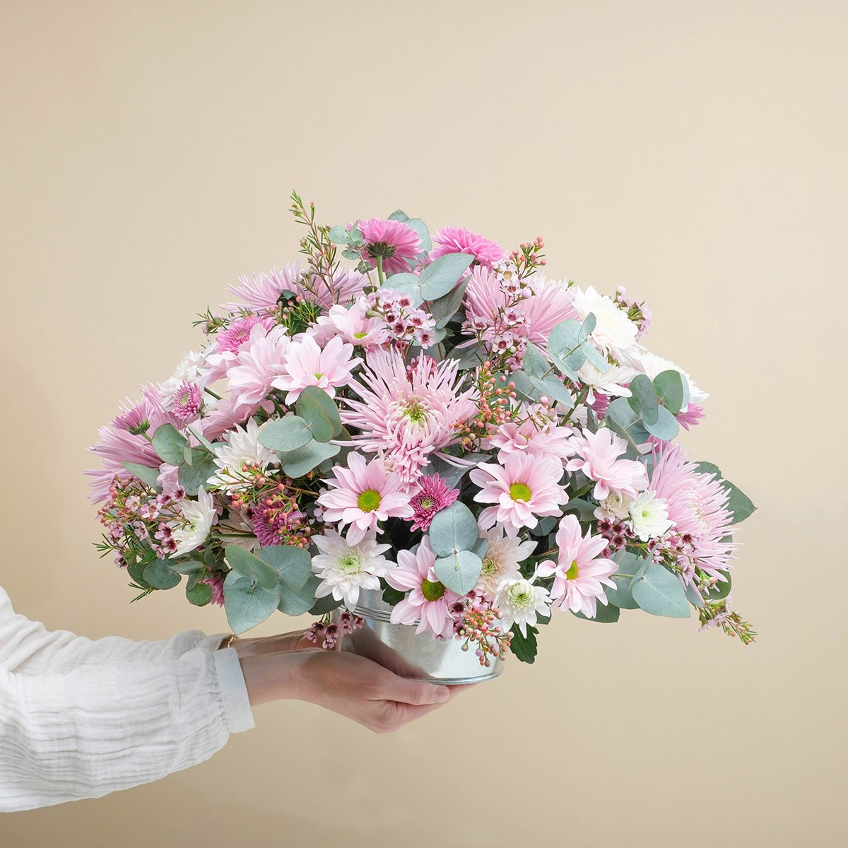 Funeral centrepiece in pink tones