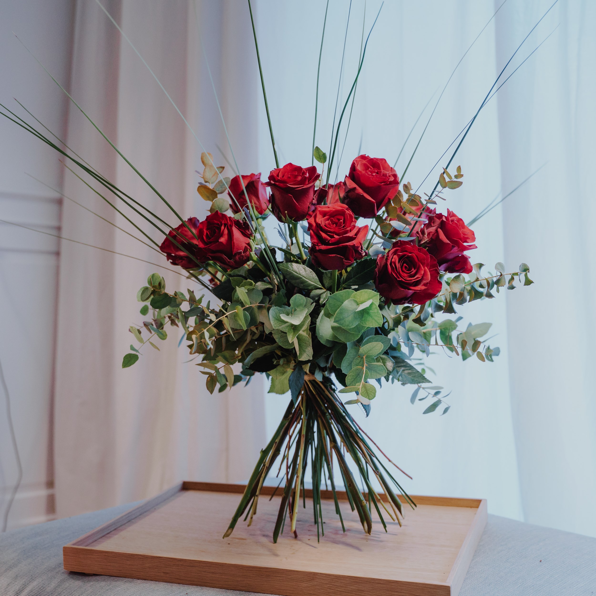 12 Red Roses with greenery